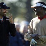 Vijay Singh, right, of Fiji chats with Alvaro Quiros of Spain on the first tee during a practice round for the Masters golf tournament Wednesday, April 6, 2011, in Augusta, Ga. (AP Photo/Matt Slocum)
 