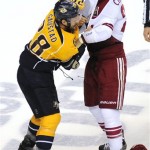 Nashville Predators center Paul Gaustad (28) and Phoenix Coyotes center Kyle Chipchura (24) fight in the first period of Game 4 in an NHL hockey Stanley Cup Western Conference semifinal playoff series, Friday, May 4, 2012, in Nashville, Tenn. (AP Photo/Mike Strasinger)