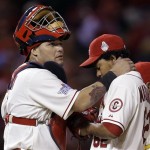  St. Louis Cardinals catcher Yadier Molina talks to relief pitcher Carlos Martinez before Martinez was pulled from the game during the eighth inning of Game 3 of baseball's World Series against the Boston Red Sox Saturday, Oct. 26, 2013, in St. Louis. (AP Photo/Jeff Roberson)