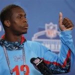 West Virginia quarterback Geno Smith begins a news conference at the NFL football scouting combine in Indianapolis, Friday, Feb. 22, 2013. (AP Photo/Michael Conroy)