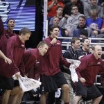 Harvard players celebrate on the bench after beating New Mexico during a second round game in the NCAA college basketball tournament in Salt Lake City Thursday, March 21, 2013. Harvard beat New Mexico 68-62. (AP Photo/George Frey)