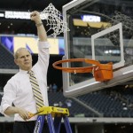 Michigan head coach John Beilein reacts after cutting down the net after a regional final game against Florida in the NCAA college basketball tournament, Sunday, March 31, 2013, in Arlington, Texas. Michigan won 79-59 to advance to the Final Four. (AP Photo/David J. Phillip)