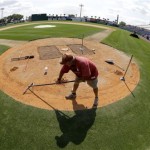 Grounds crew member Michael Schnee works around home plate at Space Coast Stadium, the Washington Nationals spring training facility, Monday, Feb. 11, 2013 in Viera, Fla. Nationals pitchers and catchers first spring training workout is Thursday. (AP Photo/David J. Phillip)