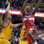 Washington Wizards' Jordan Crawford (15) goes in for a shot against Cleveland Cavaliers' Anderson Varejao, left, from Brazil, during the third quarter of an NBA basketball game Tuesday, Oct. 30, 2012, in Cleveland. Crawford led the Wizards with 11 points in a 94-84 loss to Cleveland. (AP Photo/Mark Duncan)