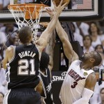 San Antonio Spurs power forward Tim Duncan (21) shoots against Miami Heat shooting guard Dwyane Wade (3) during the first half of Game 6 of the NBA Finals basketball game, Tuesday, June 18, 2013 in Miami. (AP Photo/Lynne Sladky)