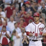 Washington Nationals' Bryce Harper heads to the plate as the fans stands up during the first inning of a baseball game between the Nationals and the Arizona Diamondbacks at Nationals Park in Washington, Tuesday, May 1, 2012. (AP Photo/Susan Walsh)