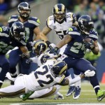  Seattle Seahawks running back Marshawn Lynch (24) rushes past the tackle attempt of St. Louis Rams cornerback Trumaine Johnson (22) in the second half of an NFL football game, Sunday, Dec. 29, 2013, in Seattle. The Seahawks won 27-9. (AP Photo/John Froschauer)
