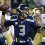  Seattle Seahawks' Russell Wilson throws during the second half of the NFL football NFC Championship game against the San Francisco 49ers, Sunday, Jan. 19, 2014, in Seattle. (AP Photo/Ted S. Warren)