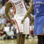 Houston Rockets' James Harden (13) reacts after being fouled as Oklahoma City Thunder's Derek Fisher (6) walks past during the fourth quarter of Game 3 in a first-round NBA basketball playoff series Saturday, April 27, 2013, in Houston. The Thunder beat the Rockets 104-101. (AP Photo/David J. Phillip)