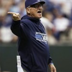 Tampa Bay Rays manager Joe Maddon signals to the bullpen for a pitcher to relieve Jamey Wright in the third inning in Game 4 of an American League baseball division series against the Boston Red Sox, Tuesday, Oct. 8, 2013, in St. Petersburg, Fla. (AP Photo/Chris O'Meara)