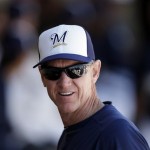 Milwaukee Brewers manager Ron Roenicke looks around the dugout during an intrasquad game at spring training baseball Friday, Feb. 22, 2013, in Phoenix. (AP Photo/Morry Gash)