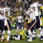 Green Bay Packers' Aaron Rodgers lays on the ground after being sacked by Chicago Bears' Shea McClellin during the first half of an NFL football game Monday, Nov. 4, 2013, in Green Bay, Wis. (AP Photo/Morry Gash)