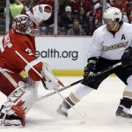 Detroit Red Wings goalie Jimmy Howard (35) stops a shot by Anaheim Ducks' Teemu Selanne (8), of Finland, during the first period in Game 2 of a first-round NHL hockey Stanley Cup playoff series in Detroit, Saturday, May 4, 2013. (AP Photo/Paul Sancya)