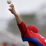 The ball comes off the hand of Philadelphia Phillies starting pitcher John Lannan as he throws in the first inning of an exhibition spring training baseball game against the Minnesota Twins, Wednesday, Feb. 27, 2013, in Fort Myers, Fla. (AP Photo/David Goldman)