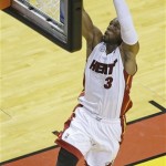 Miami Heat shooting guard Dwyane Wade (3) shoots against the Indiana Pacers during the first half of Game 7 in their NBA basketball Eastern Conference finals playoff series, Monday, June 3, 2013 in Miami. (AP Photo/Wilfredo Lee)
