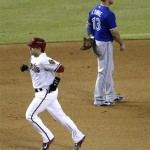 Toronto Blue Jays' Brett Lawrie (13) looks away as Arizona Diamondbacks' Miguel Montero rounds the bases after hitting a solo home run in the seventh inning of a baseball game, Tuesday, Sept. 3, 2013, in Phoenix. (AP Photo/Matt York)