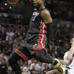 Miami Heat's Dwyane Wade (3) dunks against the San Antonio Spurs during the second half at Game 4 of the NBA Finals basketball series, Thursday, June 13, 2013, in San Antonio. (AP Photo/Eric Gay)