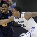 Kansas State guard Rodney McGruder (22) and La Salle guard Sam Mills (10) chase a loose ball during the first half of a second-round game of the NCAA men's college basketball tournament Friday, March 22, 2013, in Kansas City, Mo. (AP Photo/Charlie Riedel)