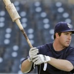 San Diego Padres' Jedd Gyorko swings a weighted bat while getting ready for batting practice prior to a baseball game between the Padres and Arizona Diamondbacks Tuesday, Sept. 24, 2013, in San Diego. (AP Photo/Lenny Ignelzi)