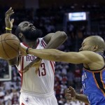 Houston Rockets' James Harden (13) has the ball knocked away by Oklahoma City Thunder's Derek Fisher, right, during the third quarter of Game 3 in a first-round NBA basketball playoff series Saturday, April 27, 2013, in Houston. The Thunder beat the Rockets 104-101. (AP Photo/David J. Phillip)