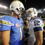 Indianapolis Colts quarterback Andrew Luck, right, and San Diego Chargers quarterback Philip Rivers talk after the Chargers' 19-9 victory in a NFL football game Monday, Oct. 14, 2013, in San Diego. (AP Photo/Denis Poroy)