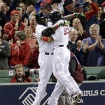 Boston Red Sox's Shane Victorino, right, celebrates his grand slam with David Ortiz in the seventh inning during Game 6 of the American League baseball championship series against the Detroit Tigers on Saturday, Oct. 19, 2013, in Boston.(AP Photo/Charlie Riedel)