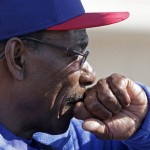Texas Rangers manager Ron Washington watches a spring training baseball workout Thursday, Feb. 14, 2013, in Surprise, Ariz. (AP Photo/Charlie Riedel)