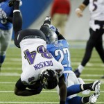 Baltimore Ravens tight end Ed Dickson (84) is upended by Detroit Lions strong safety Glover Quin (27) during the second quarter of an NFL football game in Detroit, Monday, Dec. 16, 2013. (AP Photo/Duane Burleson)
