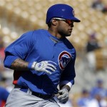 Chicago Cubs' Darnell McDonald rounds the bases after hitting a three-run home run against the Los Angeles Dodgers in the third inning of an exhibition spring training baseball game in Glendale, Ariz., Monday, Feb. 25, 2013. (AP Photo/Paul Sancya)