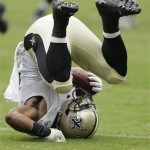 New Orleans Saints' Mark Ingram (22) tumbles to the turf against the Houston Texans during the first half of a preseason NFL football game Sunday, Aug. 25, 2013, in Houston. (AP Photo/Eric Gay)