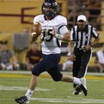  Northern Arizona quarterback Chase Cartwright looks to pass against Arizona State during the first half of a football game on Thursday, Aug. 30 2012, in Tempe, Ariz. (AP Photo/Rick Scuteri)