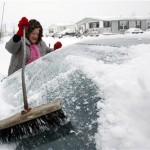 Sandi Kintzel clears snow from her car during 
the blustery, wintry weather in Buffalo, N.Y., 
Tuesday, Dec. 14, 2010. (AP Photo)