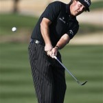 Phil Mickelson chips to the 15th green during the first round of the Waste Management Phoenix Open golf tournament Thursday, Jan. 31, 2013, in Scottsdale, Ariz. (AP Photo/Ross D. Franklin)