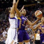 Los Angeles Sparks' Lindsey Harding (10) drives against Phoenix Mercury's Diana Taurasi during the first half of Game 2 of a WNBA basketball Western Conference semifinal series, Saturday, Sept. 21, 2013, in Phoenix. (AP Photo/Matt York)