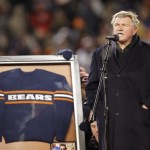 Former Chicago Bears player and coach Mike Ditka speaks to the fans at Soldier Field as his No. 89 is retired during a halftime ceremony of an NFL football game between the Bears and Dallas Cowboys, Monday, Dec. 9, 2013, in Chicago. (AP Photo/Nam Y. Huh)