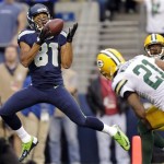 Seattle Seahawks wide receiver Golden Tate (81) catches a pass for a touchdown ahead of Green Bay Packers cornerback Charles Woodson (21) in the first half of an NFL football game, Monday, Sept. 24, 2012, in Seattle. (AP Photo/Stephen Brashear)