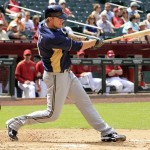 Milwaukee Brewers' Corey Hart connects on a home run against the Arizona Diamondbacks during the fourth inning of an exhibition baseball game on Wednesday, April 4, 2012, in Phoenix. (AP Photo/Ross D. Franklin)