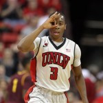  UNLV's Kevin Olekaibe gestures after sinking a three during the first half of an NCAA college basketball game against Arizona State on Tuesday, Nov. 19, 2013, in Las Vegas. (AP Photo/Isaac Brekken)
