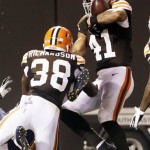 Cleveland Browns linebacker Justin Cole (41) clutches the ball for an interception in the end zone ending a preseason NFL football game against the St. Louis Rams, Thursday, Aug. 8, 2013, in Cleveland. The Browns won 27-19. (AP Photo/Tony Dejak)