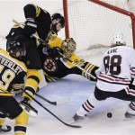 Boston Bruins center Rich Peverley (49), defenseman Zdeno Chara, second from left, of Slovakia, and goalie Tuukka Rask, center, of Finland, defend the net against Chicago Blackhawks right wing Patrick Kane (88) during the second period in Game 6 of the NHL hockey Stanley Cup Finals, Monday, June 24, 2013, in Boston. (AP Photo/Charles Krupa)