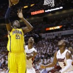 Miami Heat center Chris Bosh (1) land Miami Heat shooting guard Dwyane Wade (3) look on as Indiana Pacers center Roy Hibbert (55 ) shoots during the first half of Game 7 in their NBA basketball Eastern Conference finals playoff series, Monday, June 3, 2013 in Miami. (AP Photo/Lynne Sladky)