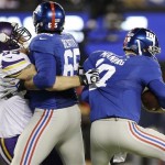 Minnesota Vikings defensive end Jared Allen (69) sacks New York Giants quarterback Eli Manning (10) as tackle Will Beatty (65) attempts to block him during the first half of an NFL football game Monday, Oct. 21, 2013 in East Rutherford, N.J. (AP Photo/Julio Cortez)