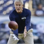 Seattle Seahawks coach Pete Carroll catches the ball as teams warm up for an NFL preseason football between the Seahawks and the San Diego Chargers on Thursday, Aug. 8, 2013, in San Diego. (AP Photo/Gregory Bull)