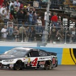 Kevin Harvick comes in to the finish line to win the NASCAR Sprint Cup Series auto race Sunday, March 2, 2014, in Avondale, Ariz. (AP Photo/Ross D. Franklin)