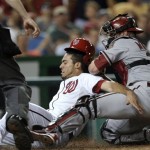 Washington Nationals' Anthony Rendon, left, is tagged out by Arizona Diamondbacks catcher Miguel Montero right, during the seventh inning of a baseball game at Nationals Park in Washington, Tuesday, June 25, 2013. The Nationals won 7-5. (AP Photo/Susan Walsh)