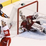 Phoenix Coyotes' Ilya Bryzgalov (30), of 
Russia, gives up a goal as referee Greg 
Kimmerly (18) gives the signal and Detroit 
Red Wings' Niklas Kronwall (55), of Sweden, 
skates to the celebration during the third 
period in Game 4 of a first-round NHL hockey 
Stanley Cup playoffs series Wednesday, April 
20, 2011, in Glendale, Ariz. The Red Wings 
defeated the Coyotes 6-3 and earned a 4-0 
sweep in the series. (AP Photo/Ross D. 
Franklin)