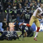  San Francisco 49ers' Colin Kaepernick scrambles during the first half of the NFL football NFC Championship game against the Seattle Seahawks Sunday, Jan. 19, 2014, in Seattle. (AP Photo/Matt Slocum)