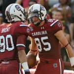 South Carolina wide receiver Kane Whitehurst (85) celebrates with teammate wide receiver K.J. Brent (80) after scoring a touchdown during the first half of an NCAA college football game against North Carolina, Thursday, Aug. 29, 2013, in Columbia, S.C. (AP Photo/Stephen Morton)