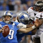 Tampa Bay Buccaneers outside linebacker Jonathan Casillas, right, reaches in on Detroit Lions quarterback Matthew Stafford (9) during the fourth quarter of an NFL football game at Ford Field in Detroit, Sunday, Nov. 24, 2013. (AP Photo/Paul Sancya)