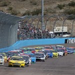 Joey Logano (22) and Brad Keselowski (2) lead at the green flag for the start of the NASCAR Sprint Cup Series auto race Sunday, March 2, 2014, in Avondale, Ariz. (AP Photo/Ross D. Franklin)